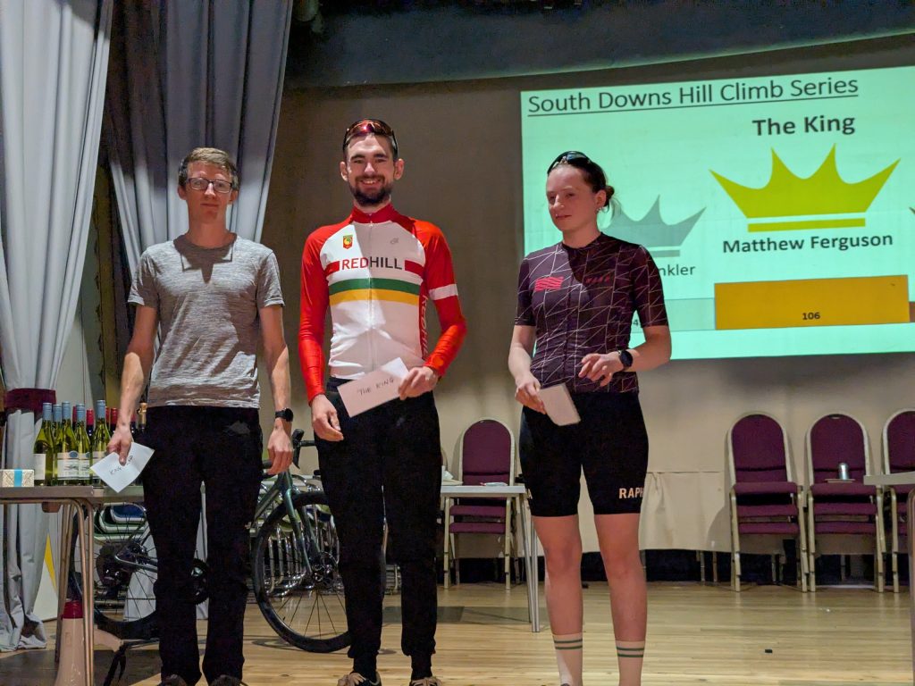 Matthew Ferguson, centre, on stage at the South Downs Hill Climb Series presentation, announced as The King